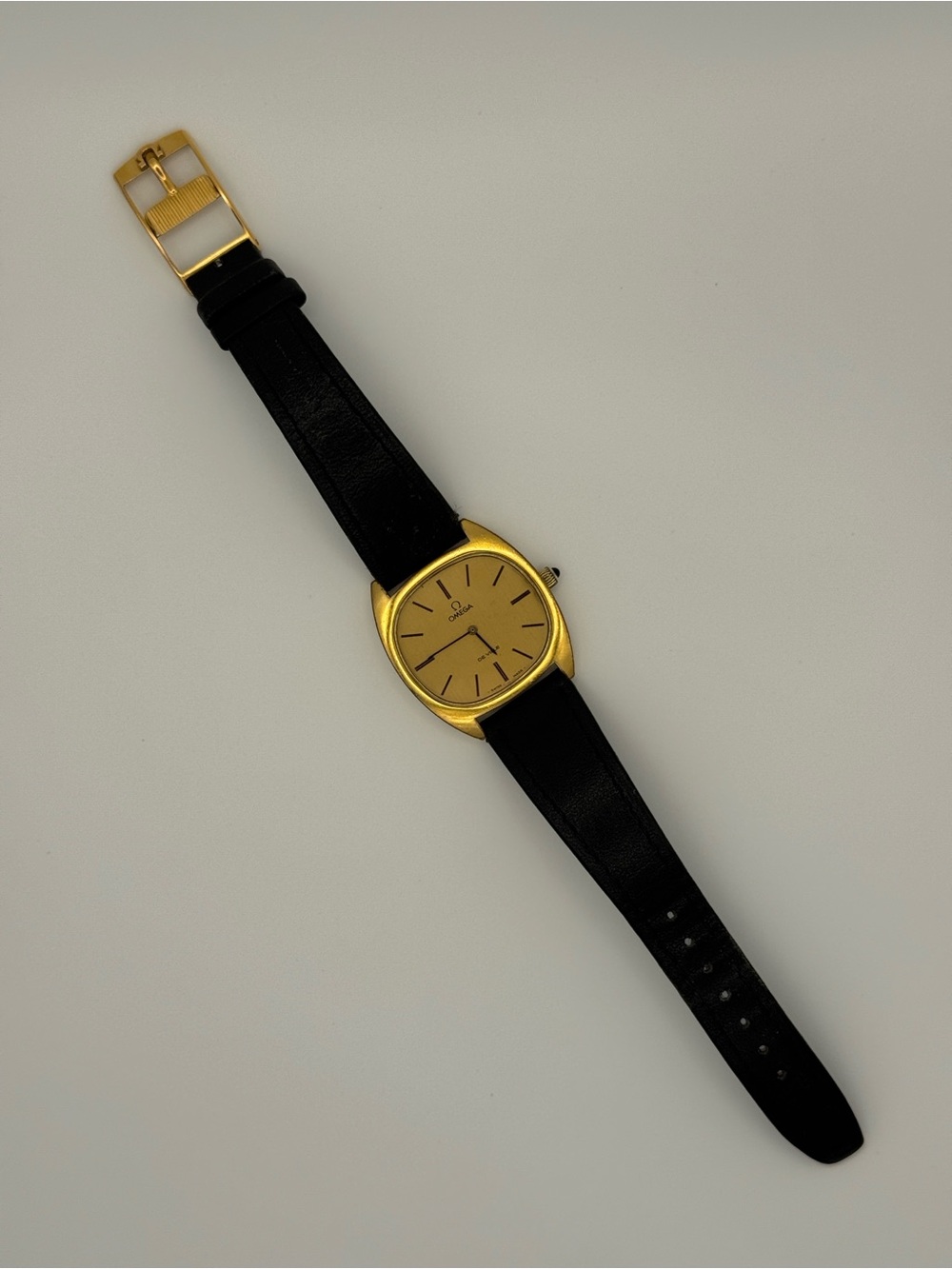 Omega Gold Dial Watch with Black Strap